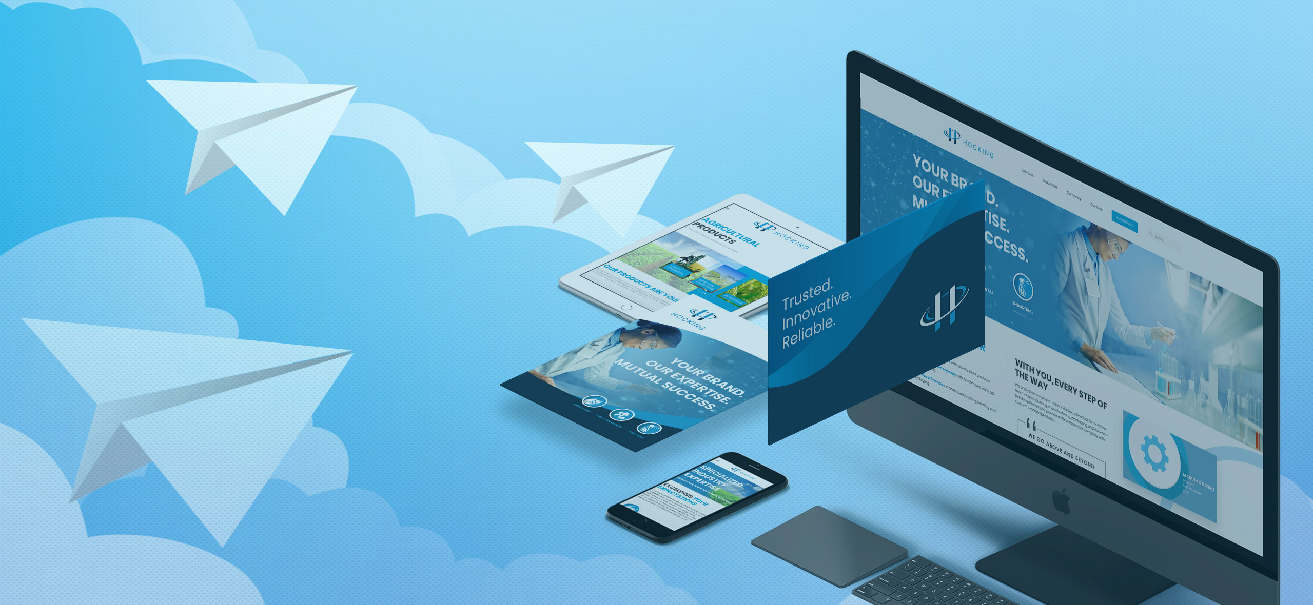Marketing website and print materials shown on laptop, tablet and phone